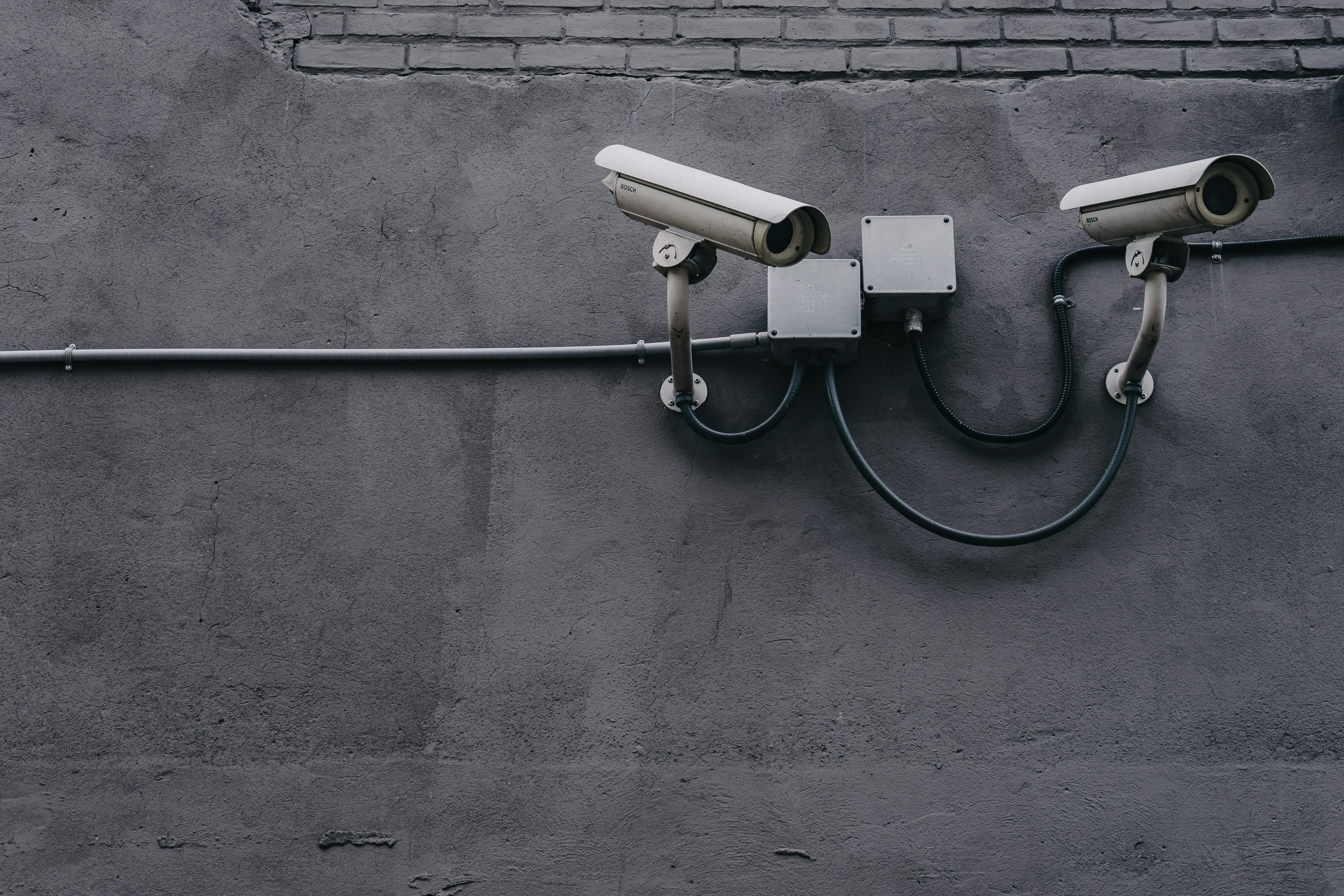 Surveillance cameras mounted on a building exterior